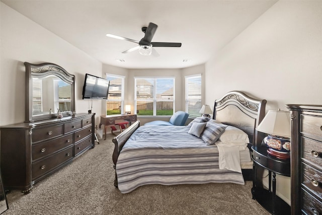 bedroom with ceiling fan and light carpet