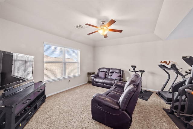 interior space featuring a tray ceiling and ceiling fan