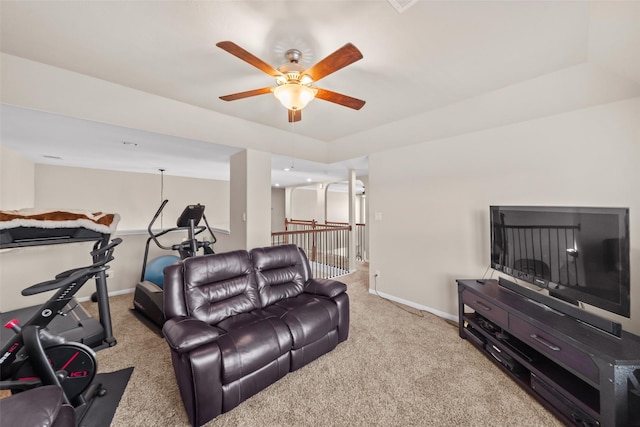 carpeted living room featuring ceiling fan