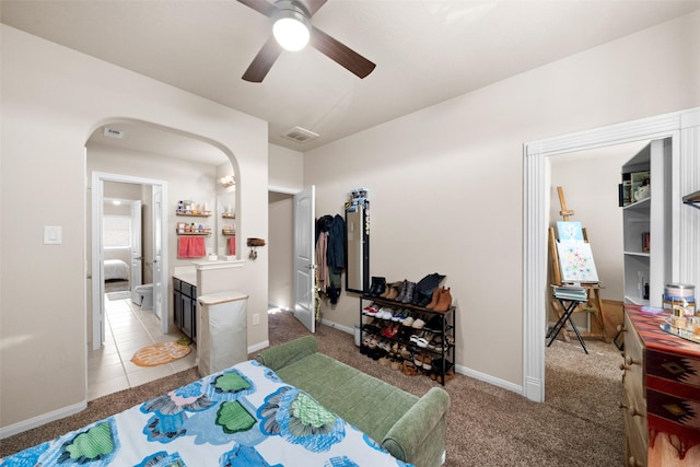 carpeted bedroom with ceiling fan