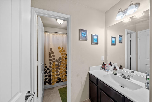 bathroom with tile patterned flooring, vanity, and curtained shower