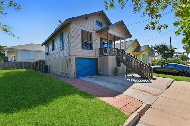 view of front of house with an attached garage, fence, stairs, concrete driveway, and a front yard