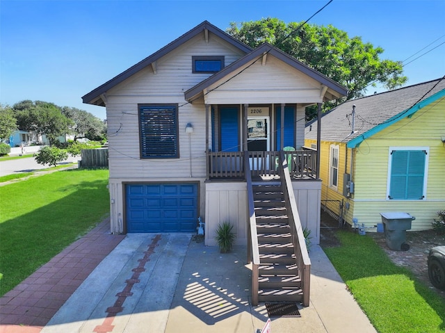 bungalow featuring a garage and a front lawn