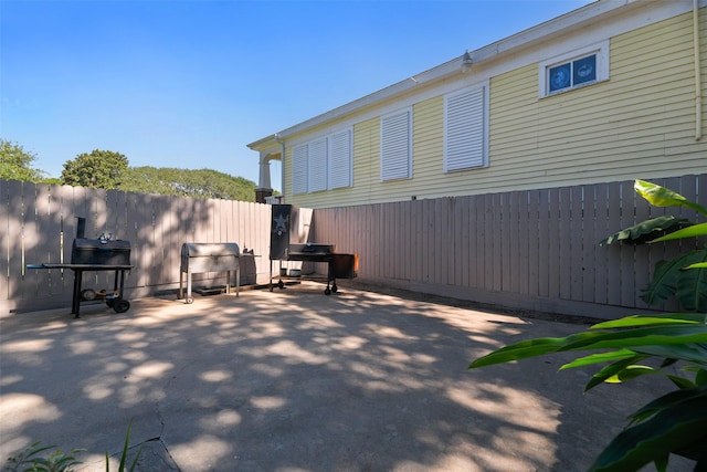 view of patio featuring fence