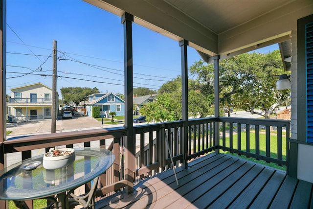 wooden deck with a residential view