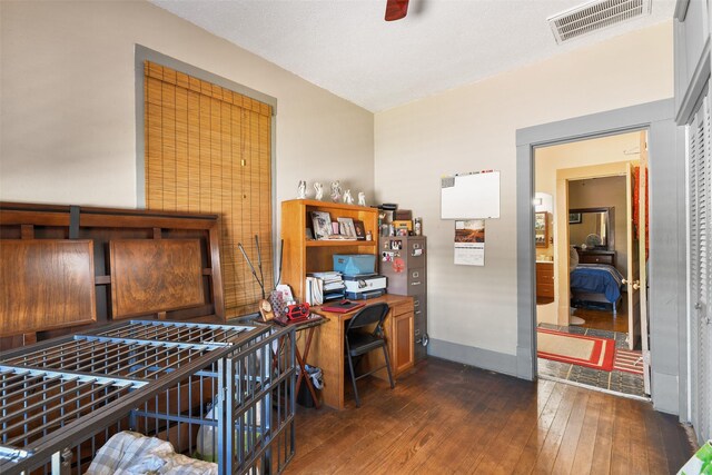 office with dark wood-type flooring