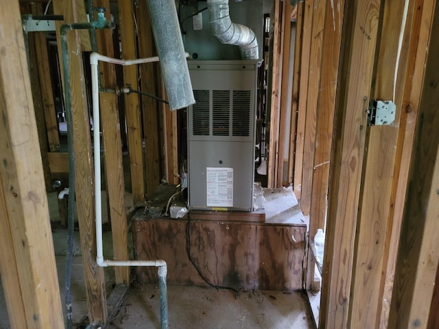 utility room with heating unit