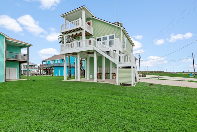 back of property featuring a lawn