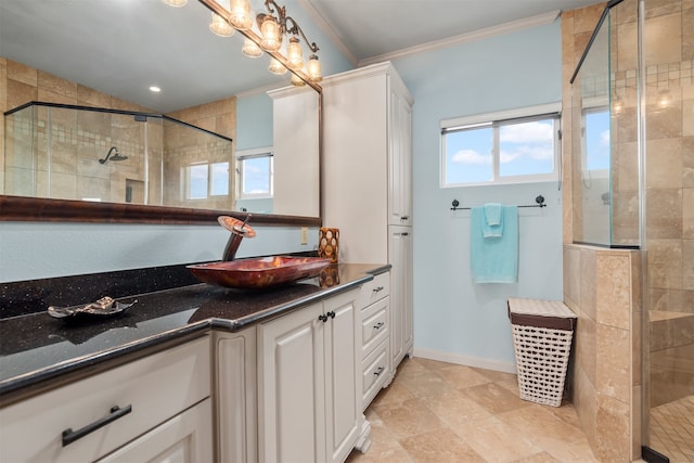 bathroom featuring vanity, an enclosed shower, and crown molding