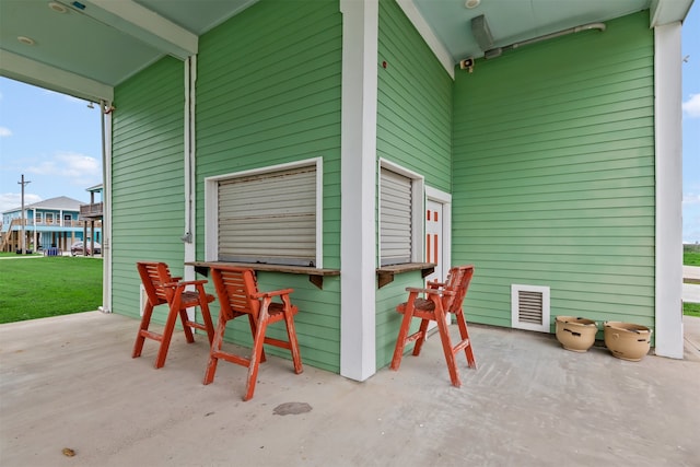 view of patio with exterior bar