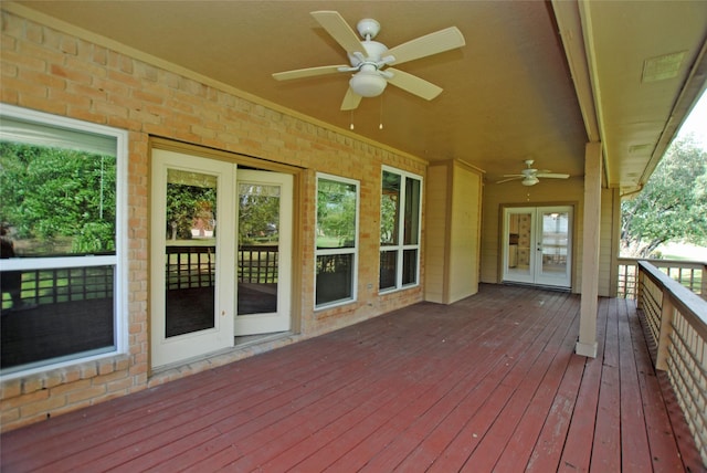 wooden terrace with ceiling fan and french doors