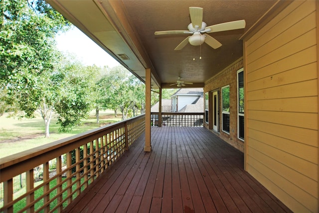 wooden deck with ceiling fan