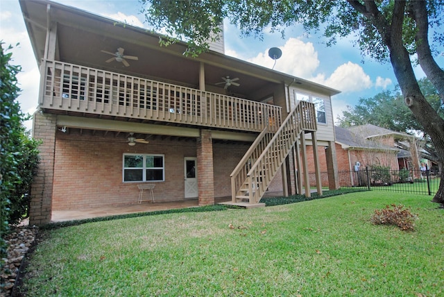 back of house with a patio area, a lawn, ceiling fan, and a deck