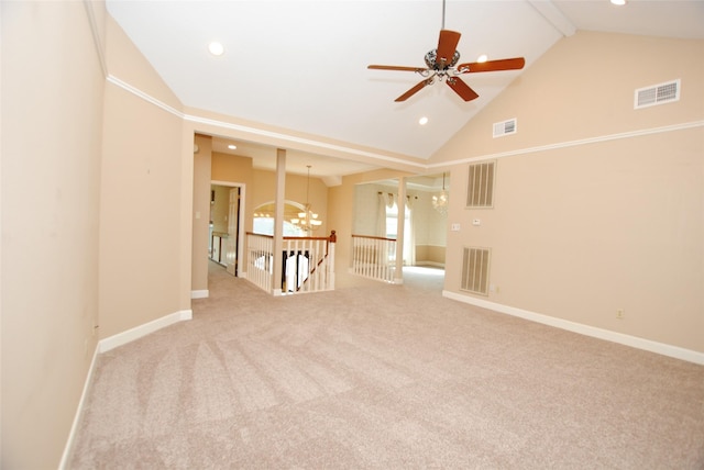 carpeted empty room featuring beam ceiling, ceiling fan with notable chandelier, and high vaulted ceiling