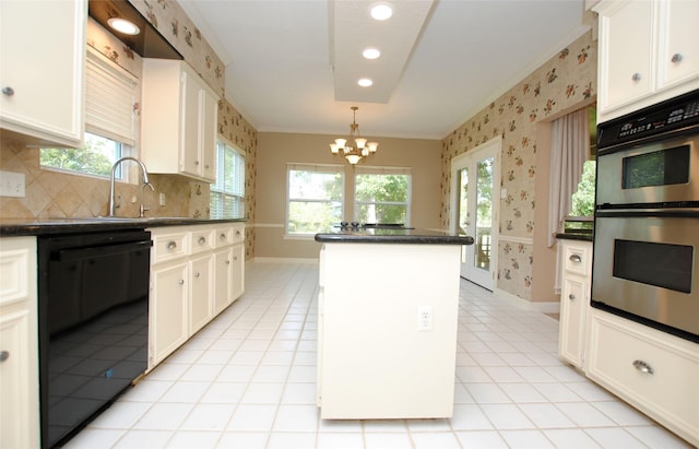 kitchen featuring white cabinetry, a kitchen island, and black dishwasher