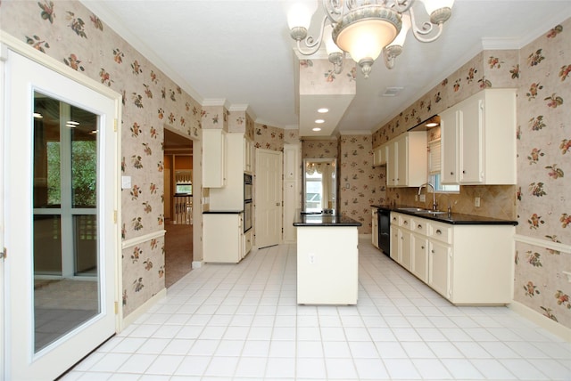 kitchen featuring sink, light tile patterned floors, white cabinetry, an inviting chandelier, and a kitchen island