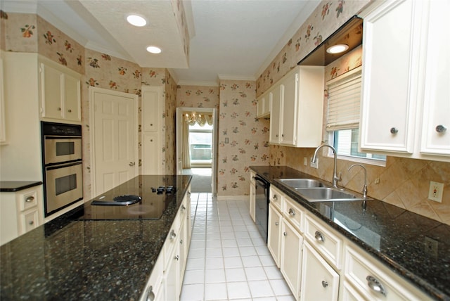 kitchen with white cabinetry, sink, light tile patterned flooring, and black appliances