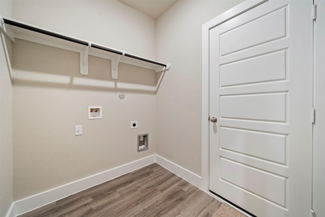 clothes washing area with washer hookup, electric dryer hookup, gas dryer hookup, and wood-type flooring