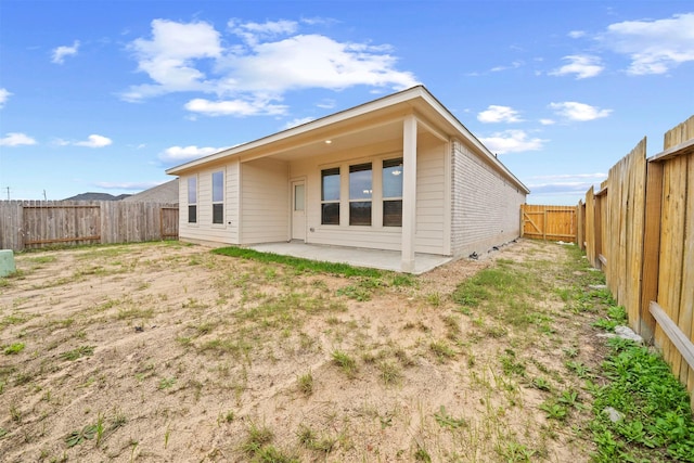 rear view of property with a patio area