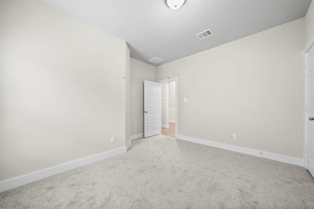 unfurnished bedroom featuring light colored carpet