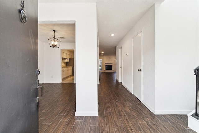 entryway with a chandelier