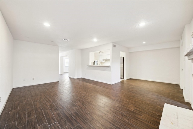 unfurnished living room with a brick fireplace