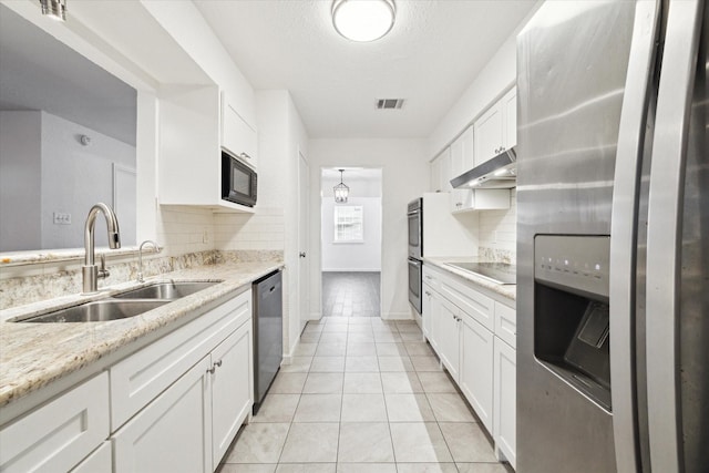 kitchen featuring light stone countertops, sink, white cabinetry, and black appliances