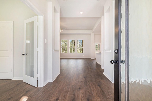 corridor featuring dark hardwood / wood-style floors