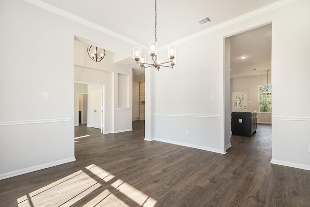 interior space featuring ornamental molding, dark wood-type flooring, and an inviting chandelier