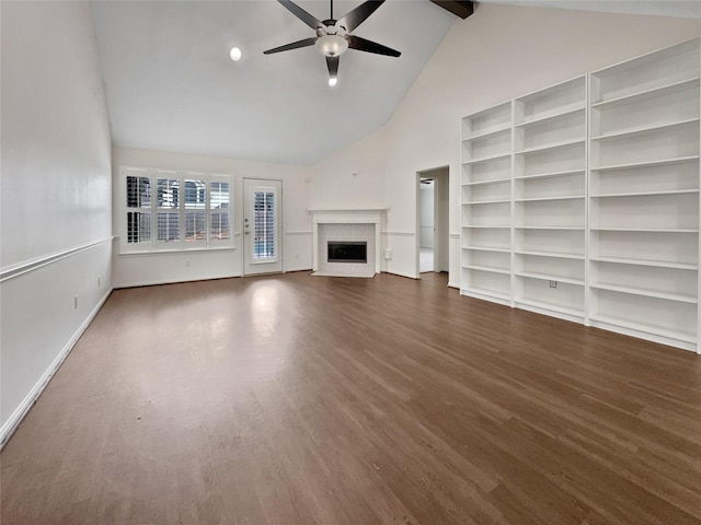 unfurnished living room with ceiling fan, beamed ceiling, dark wood-type flooring, and high vaulted ceiling