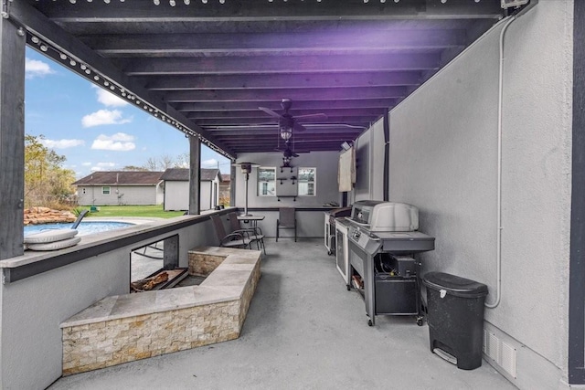 view of patio with ceiling fan and a grill