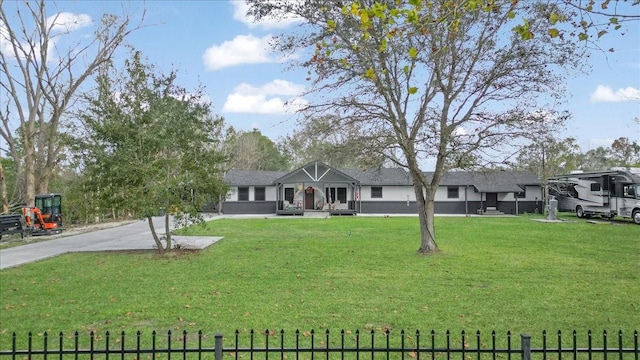 ranch-style home with a front lawn