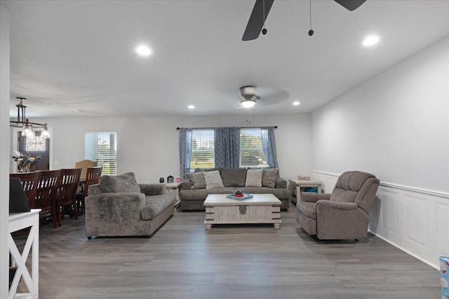 living room with hardwood / wood-style floors, ceiling fan, and a healthy amount of sunlight