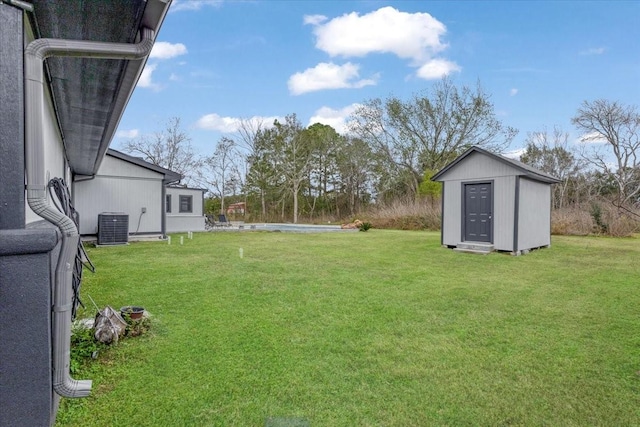 view of yard with a shed and cooling unit