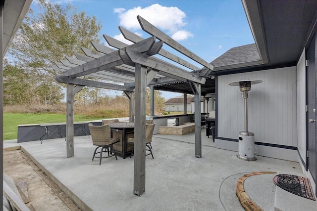 view of patio / terrace with a bar and a pergola