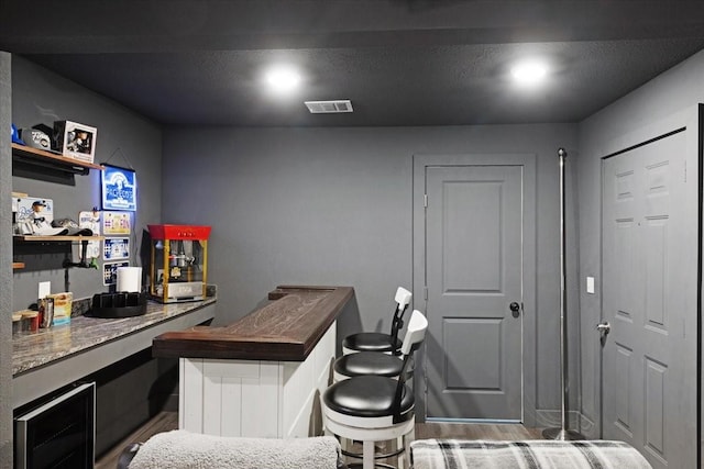 office with dark hardwood / wood-style flooring