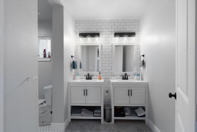 bathroom with tile patterned floors, vanity, and toilet