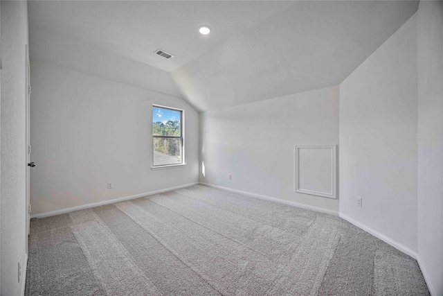 bonus room featuring carpet and vaulted ceiling