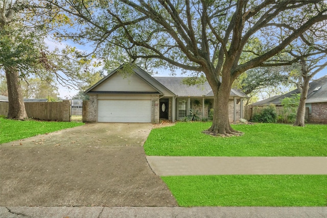 ranch-style house featuring a front yard and a garage