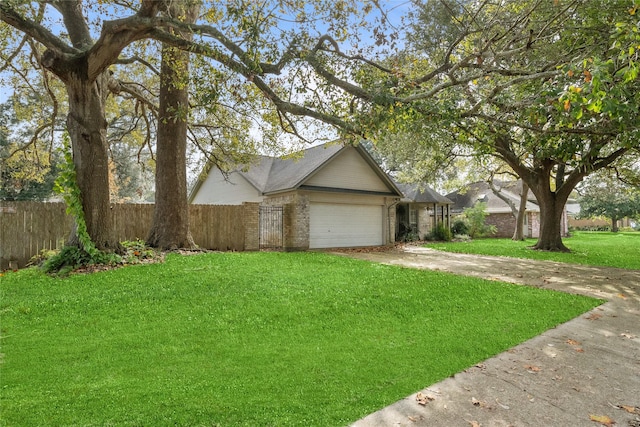 view of front of home with a garage and a front lawn