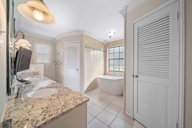 bathroom featuring a washtub, tile patterned flooring, crown molding, and a healthy amount of sunlight