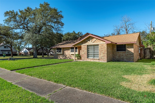 ranch-style home with a front yard