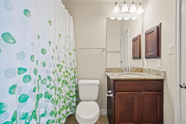 bathroom featuring vanity, a shower with shower curtain, and toilet