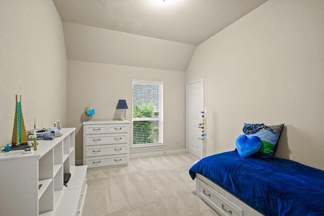 bedroom with light carpet and vaulted ceiling