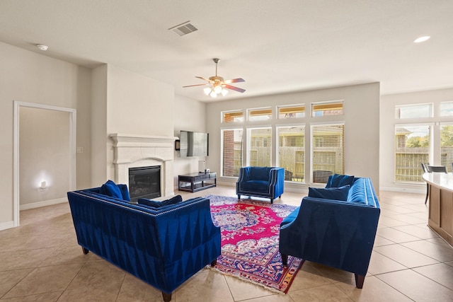 living room featuring ceiling fan and light tile patterned floors