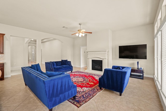 living room with ceiling fan and light tile patterned flooring