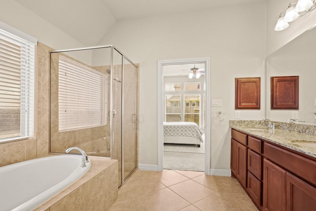 bathroom with ceiling fan, tile patterned floors, vaulted ceiling, vanity, and independent shower and bath