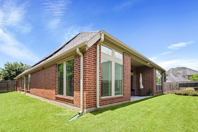 view of home's exterior featuring a yard