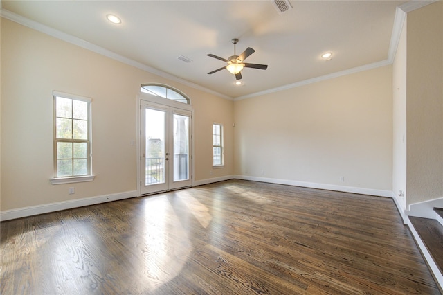 spare room with french doors, dark wood-type flooring, ceiling fan, and ornamental molding