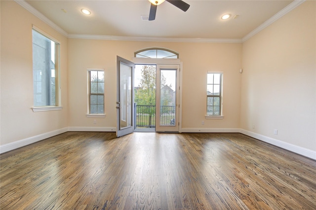 unfurnished room featuring ceiling fan, a healthy amount of sunlight, and ornamental molding